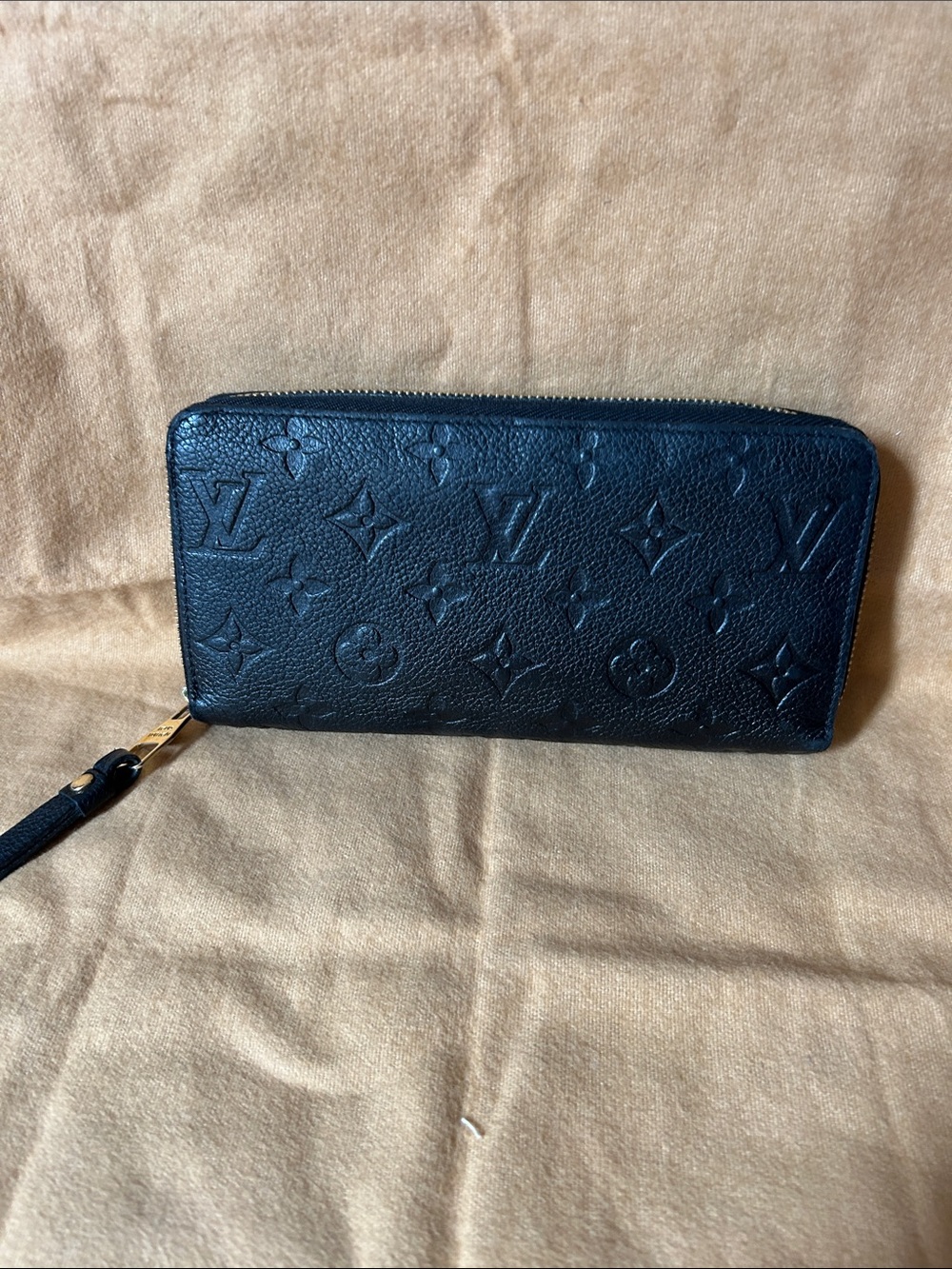 100% Authentic Louis Vuitton Black Monogram Embossed Zip Wallet with Wrist Strap